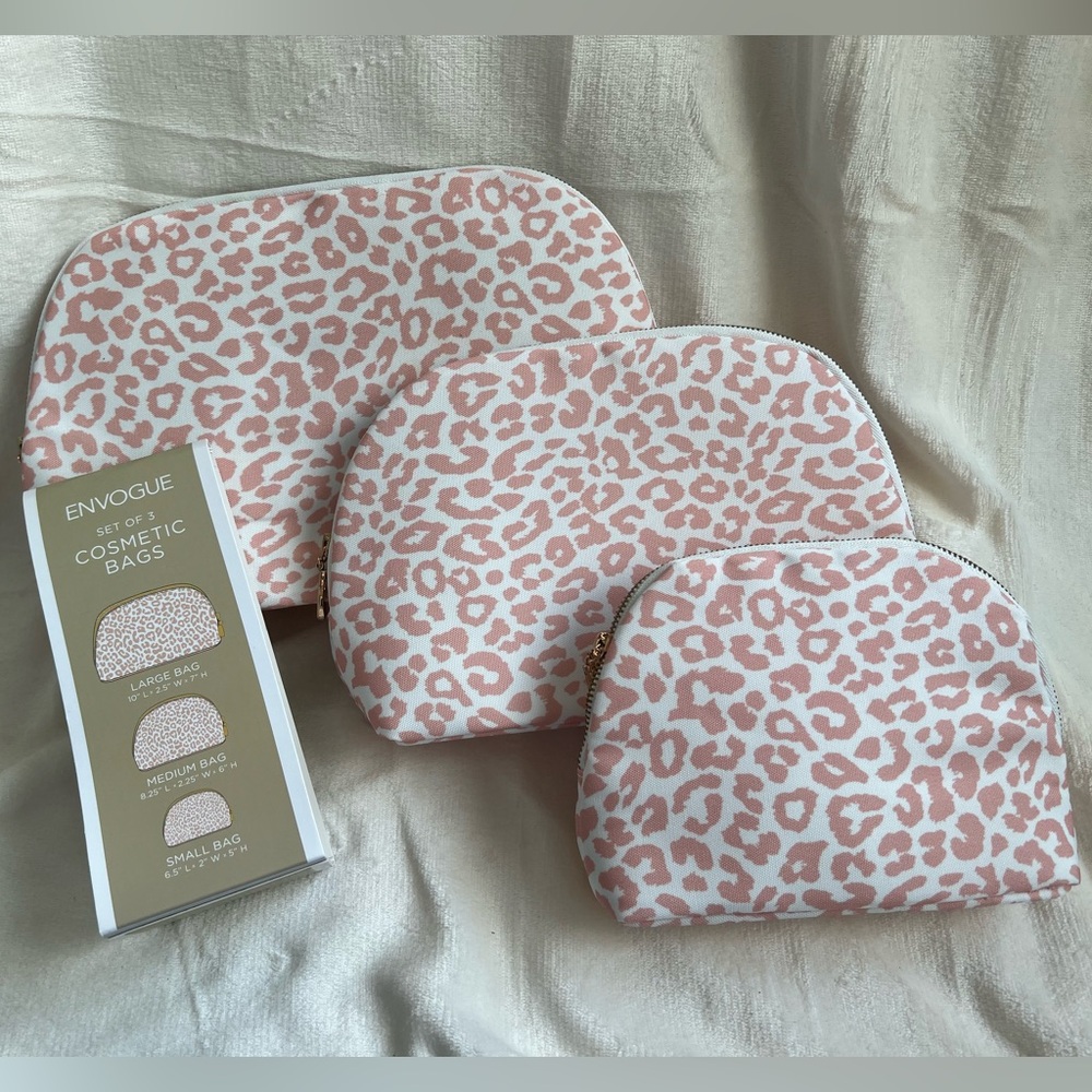 Set of three Envogue cosmetic bags with pink cheetah print on a white background